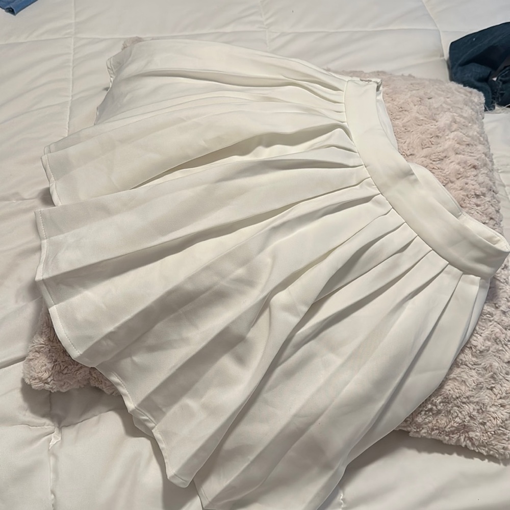 White pleated flowing skirt